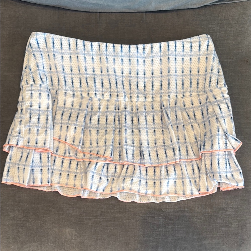 Lucky in Love women’s tennis skirt. Blue and white with hot pink detail